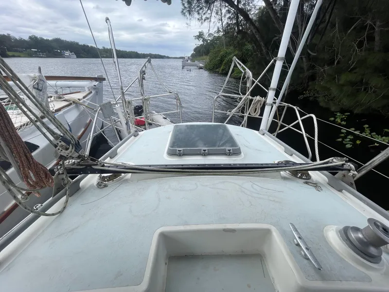 Slide: The Image of 1979 Moody 36 Classic sailboat deck view on a calm river. - 26