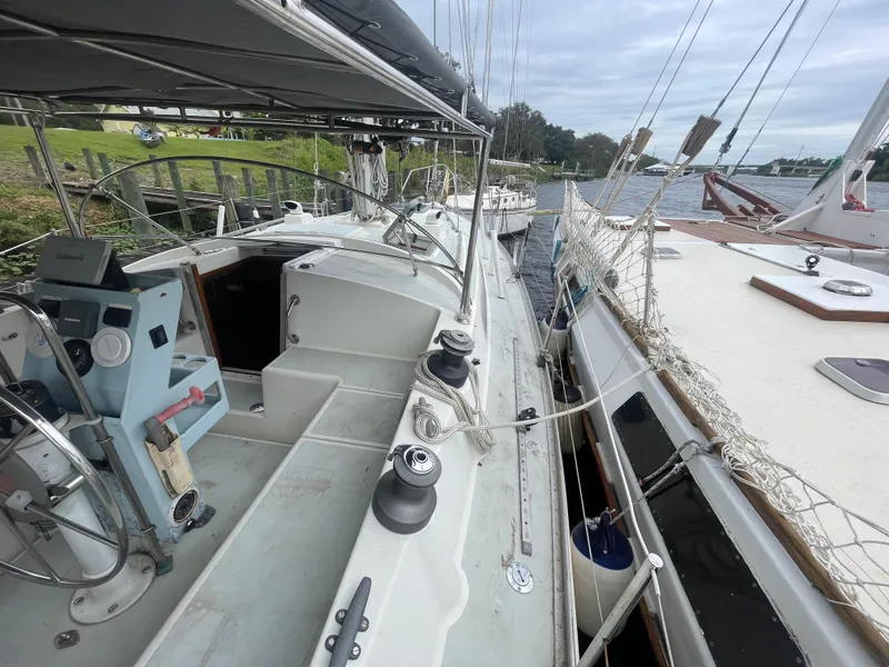 Slide: The Image of 1979 Moody 36 Classic sailboat docked, showcasing deck and cockpit details. - 28