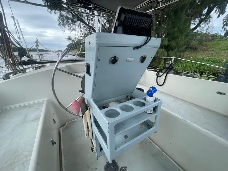 Slide: The Image of Cockpit of 1979 Moody 36 Classic sailboat with steering wheel and storage unit. - 31