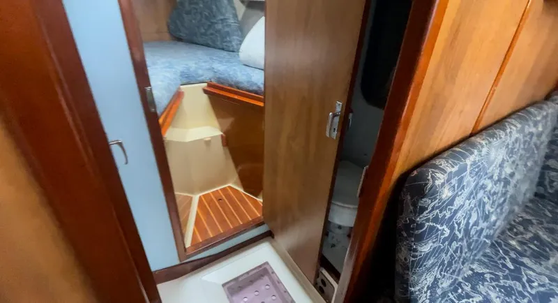 Slide: The Image of Interior of 1979 Moody 36 Classic sailboat with wood paneling and cozy cabin. - 48