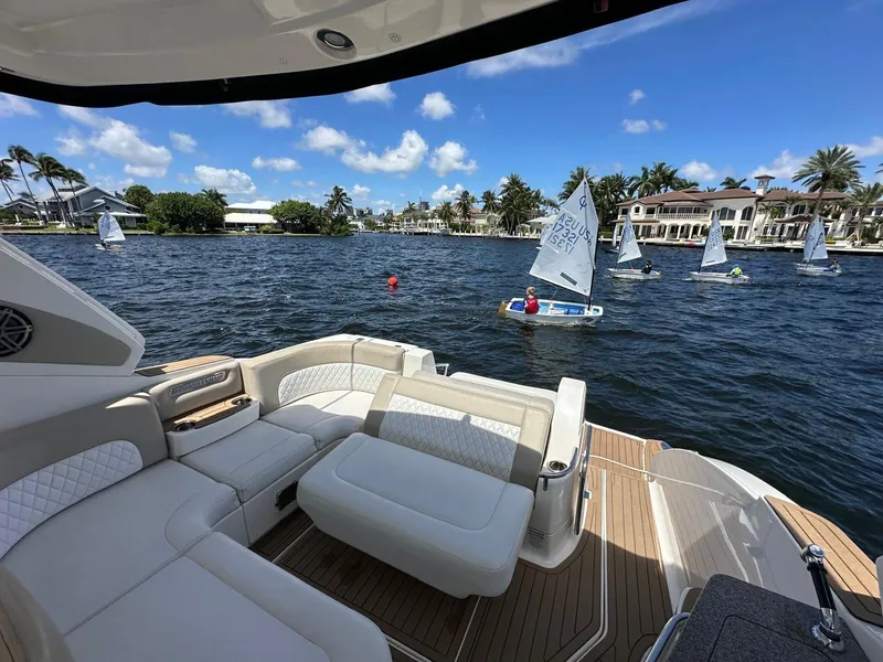 Slide: The Image of Chaparral 330 Signature 2014 yacht interior with sailboats on a sunny waterfront. - 5