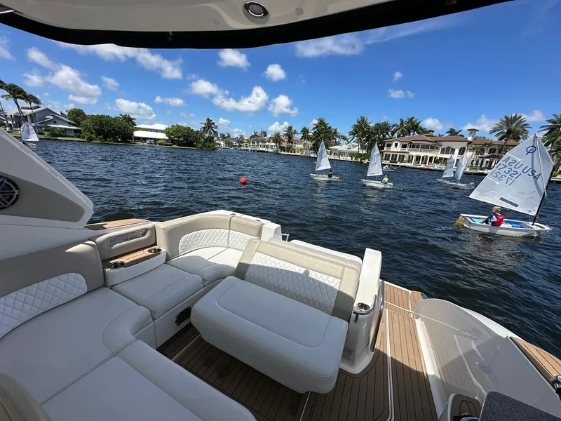 Slide: The Image of Chaparral 330 Signature 2014 yacht interior with sailboats on a sunny lake. - 6