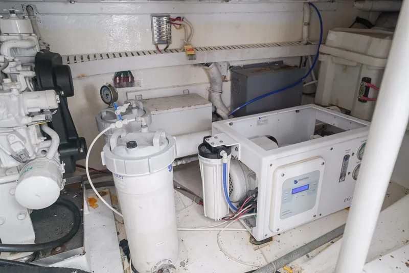 Slide: The Image of Engine room of a 2007 Bertram 510 Convertible yacht, showcasing machinery and equipment. - 29