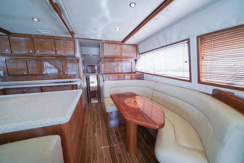 Slide: The Image of Luxurious interior of 2007 Bertram 510 Convertible yacht with wood finishes and plush seating. - 4