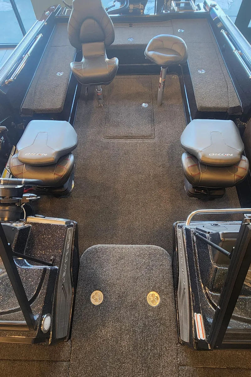 Slide: The Image of 2024 Nitro ZV21 boat interior with seating and carpeted flooring. - 5
