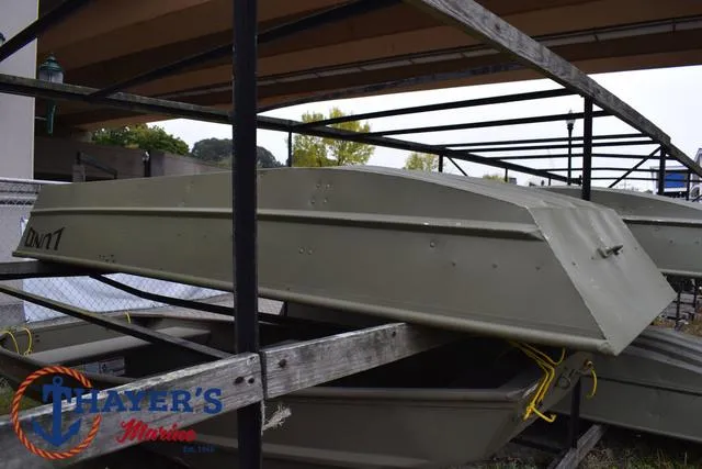 Slide: The Image of 2025 Lund 1240 Jon Tiller boat in storage rack at Thayer's Marine. - 4