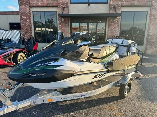 Slide: The Image of 2025 Kawasaki Jet Ski Ultra 160, sleek design, side view, white and black color scheme. - 2