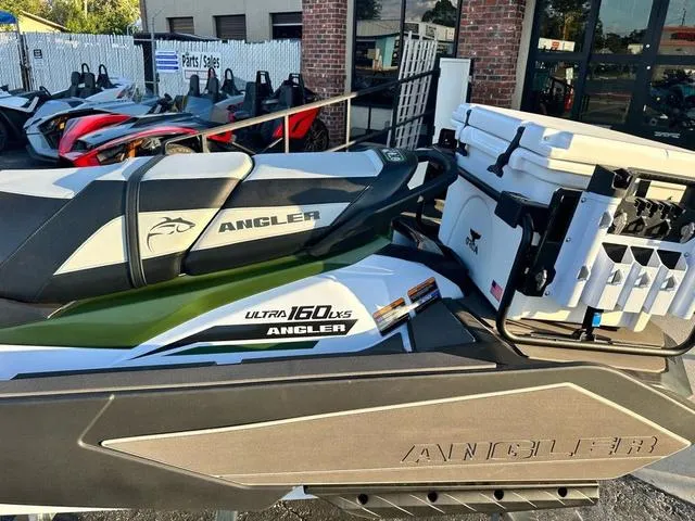 Slide: The Image of 2025 Kawasaki Jet Ski Ultra 160, Angler edition, parked outside dealership. - 6