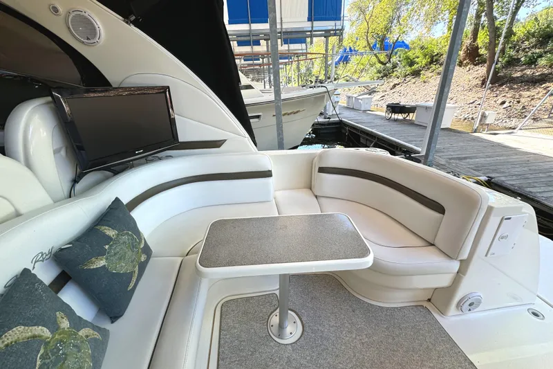Slide: The Image of Luxurious 2006 Sea Ray 38 Sundancer yacht interior with plush seating and table. - 11