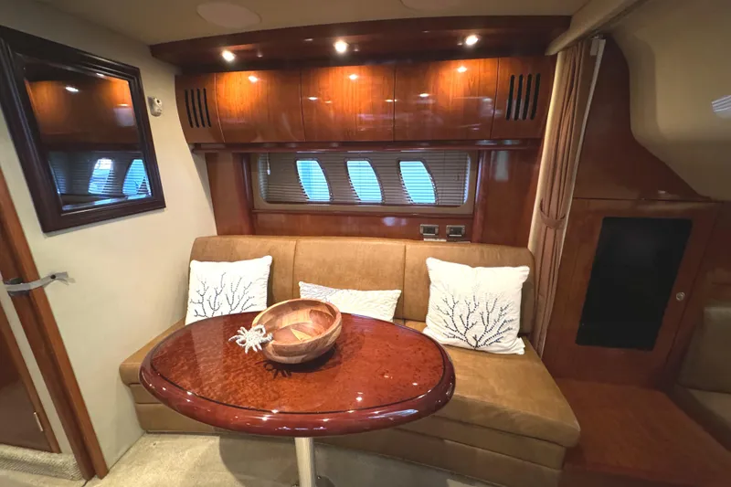 Slide: The Image of Luxurious interior of 2006 Sea Ray 38 Sundancer yacht with elegant seating and table. - 24