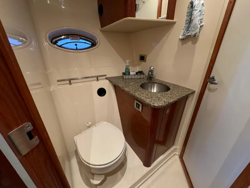 Slide: The Image of Bathroom interior of 2006 Sea Ray 38 Sundancer yacht with sink and toilet. - 34