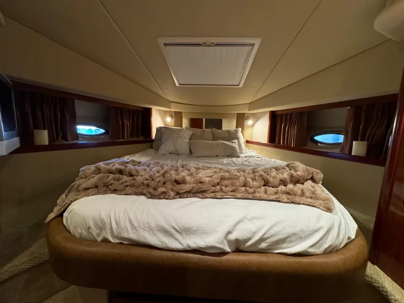 Slide: The Image of Luxurious cabin interior of 2006 Sea Ray 38 Sundancer yacht with cozy bedding. - 36