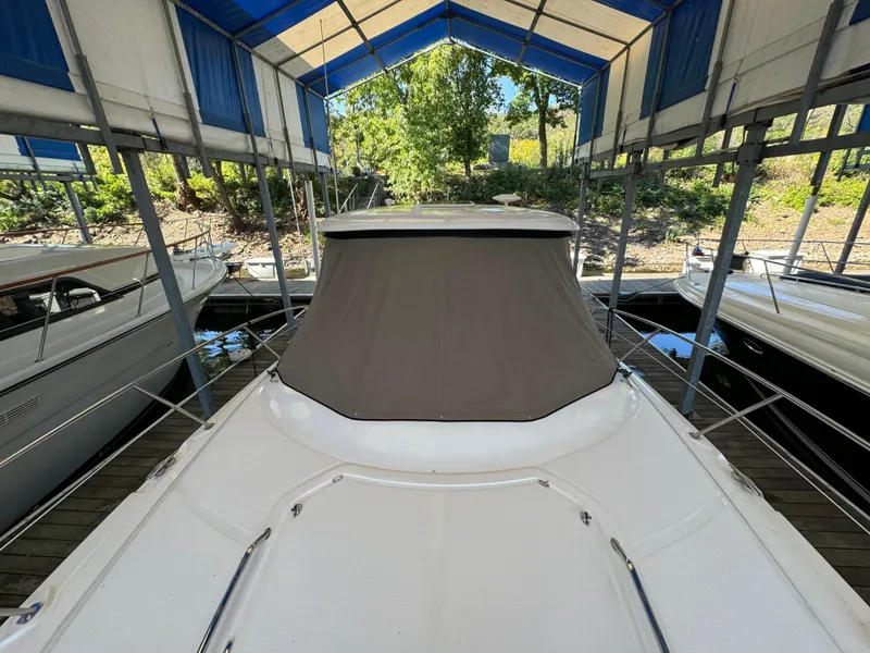 Slide: The Image of 2006 Sea Ray 38 Sundancer docked under a blue canopy. - 4