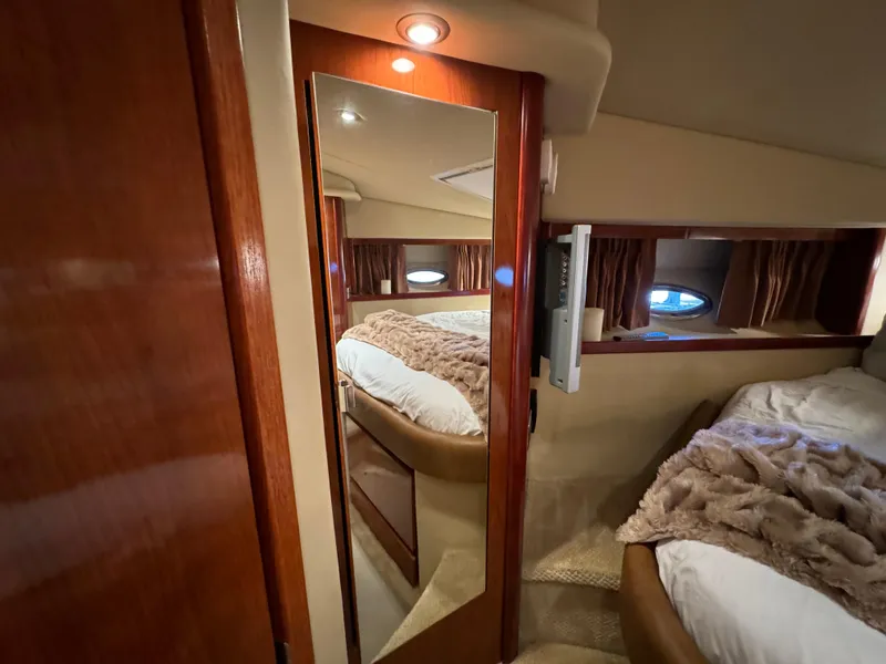 Slide: The Image of Luxurious cabin interior of 2006 Sea Ray 38 Sundancer yacht with cozy bedding. - 40