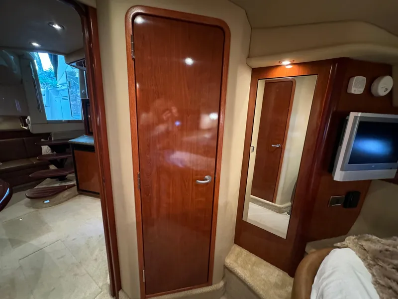 Slide: The Image of Interior of 2006 Sea Ray 38 Sundancer yacht with wooden door and mirror. - 42