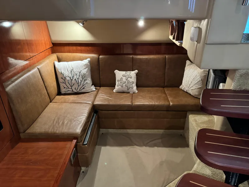 Slide: The Image of Interior of 2006 Sea Ray 38 Sundancer with leather seating and decorative pillows. - 49
