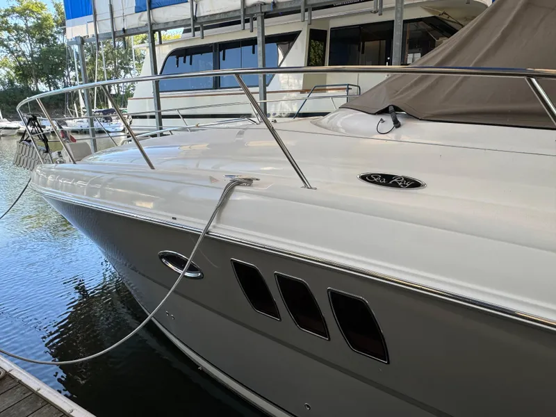 Slide: The Image of 2006 Sea Ray 38 Sundancer yacht docked at marina, side view. - 6