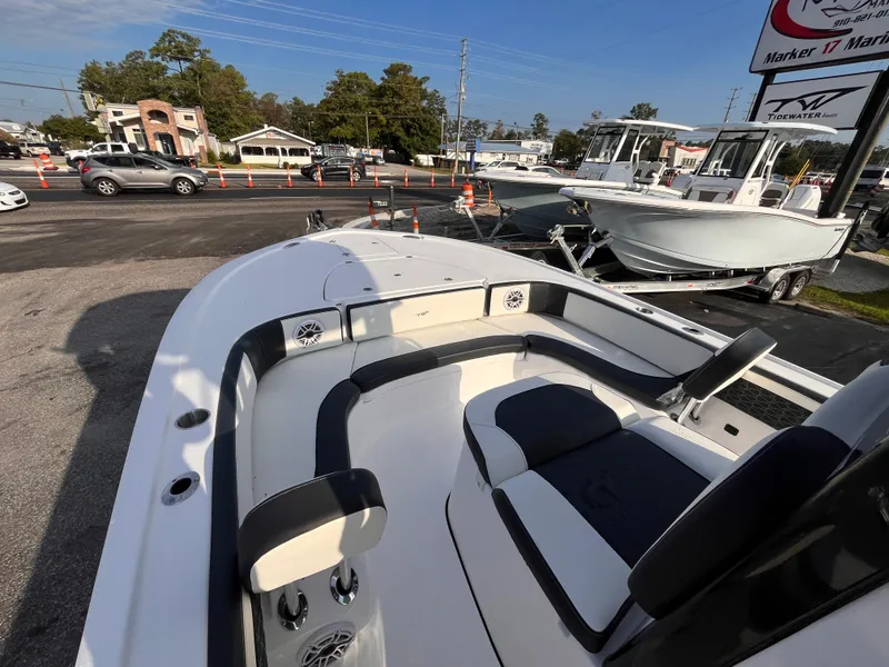 Slide: The Image of 2025 Tidewater 2700 Carolina Bay boat with spacious seating, displayed outdoors. - 13