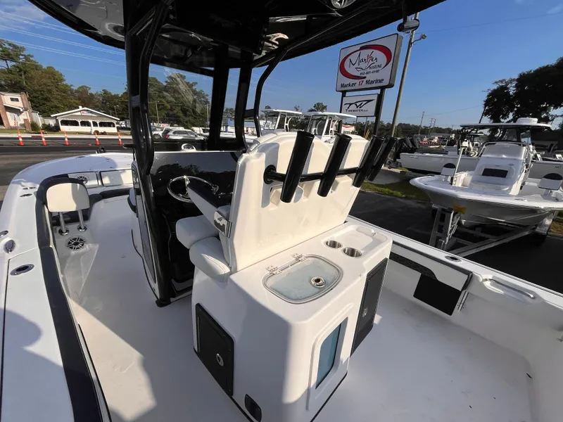 Slide: The Image of 2025 Tidewater 2700 Carolina Bay boat interior with seating and console. - 16