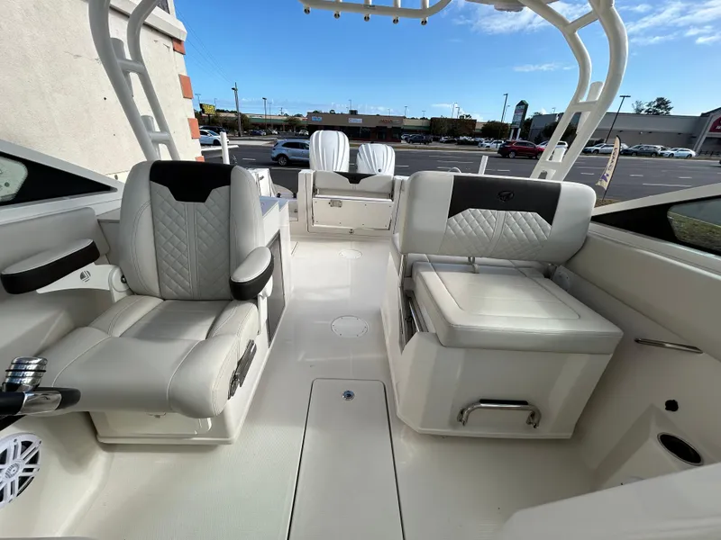 Slide: The Image of 2024 Sailfish 276 DC boat interior with luxurious seating and modern design. - 18