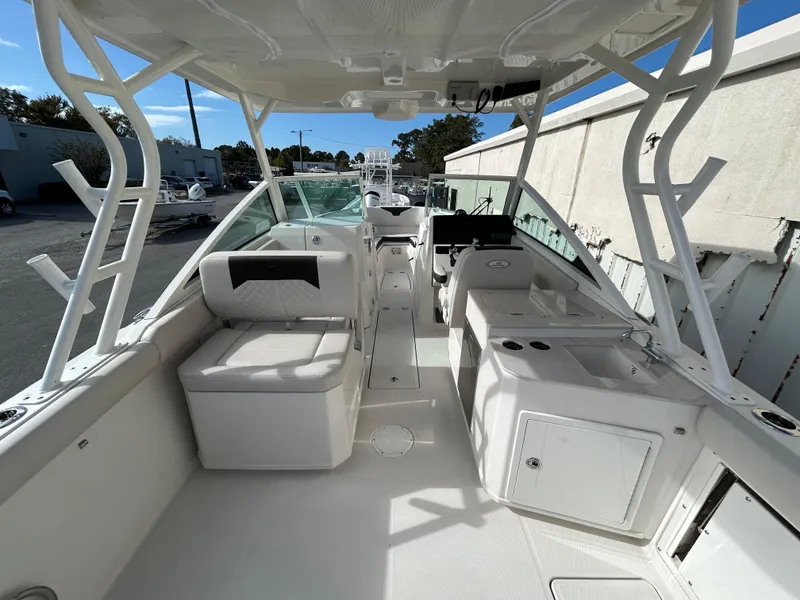 Slide: The Image of 2024 Sailfish 276 DC boat interior with seating and helm, showcasing modern design. - 20