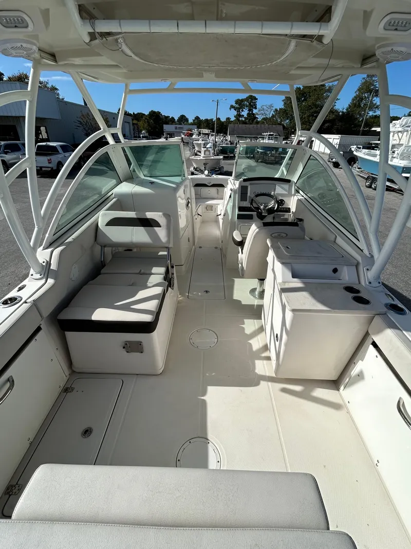 Slide: The Image of 2024 Sailfish 276 DC boat interior with seating and helm, showcasing modern design. - 21