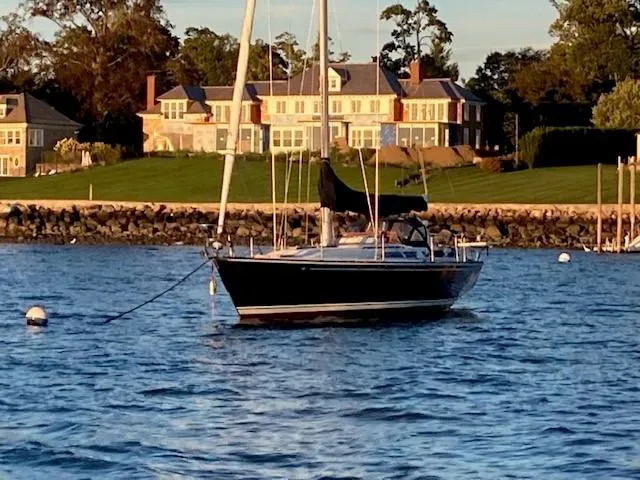 Slide: The Image of Sailboat on water near luxury homes, C&C 41 model, 1988. - 12