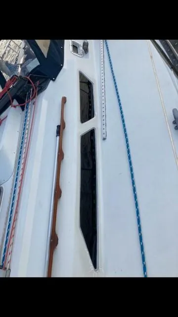 Slide: The Image of 1988 C&C 41 sailboat deck with ropes and windows. - 24