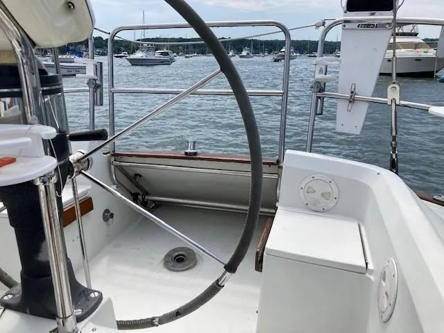 Slide: The Image of Cockpit of 1988 C&C 41 sailboat with marina view in background. - 40