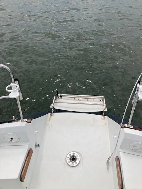 Slide: The Image of View from the stern of a 1988 C&C 41 sailboat, overlooking the water. - 42