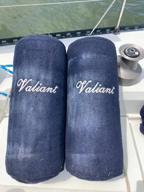 Slide: The Image of Navy blue boat cushions with "Valiant" embroidery on a 1988 C&C 41 sailboat. - 45