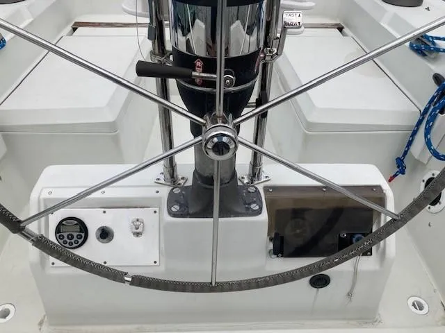 Slide: The Image of Steering wheel of a 1988 C&C 41 sailboat with navigation instruments. - 46