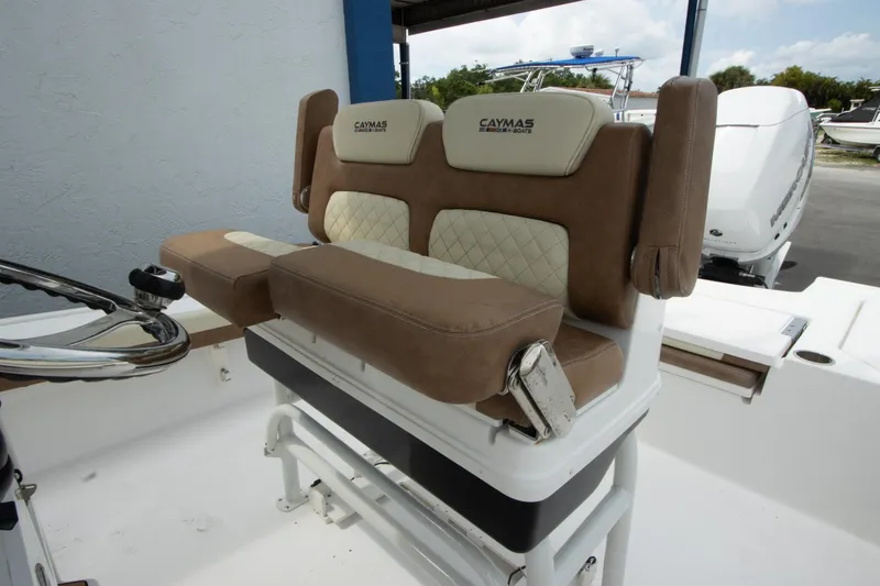 Slide: The Image of 2020 Caymas 28 HB boat seating with tan and cream upholstery. - 2