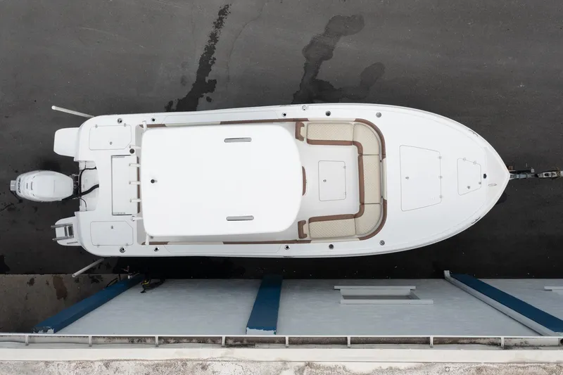 Slide: The Image of Aerial view of 2020 Caymas 28 HB boat docked on pavement. - 4