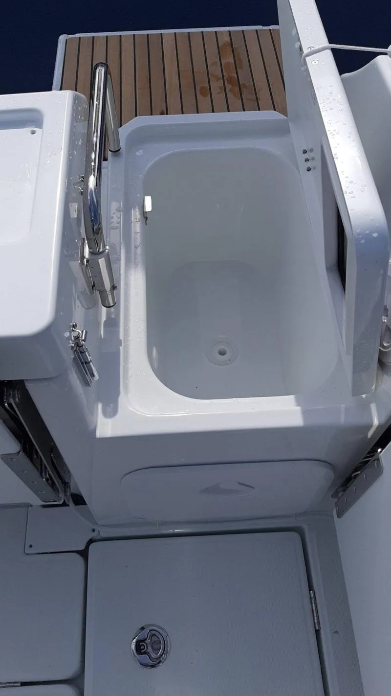 Slide: The Image of 2025 Jeanneau 795 SPORT S2 boat deck with built-in storage compartment. - 10