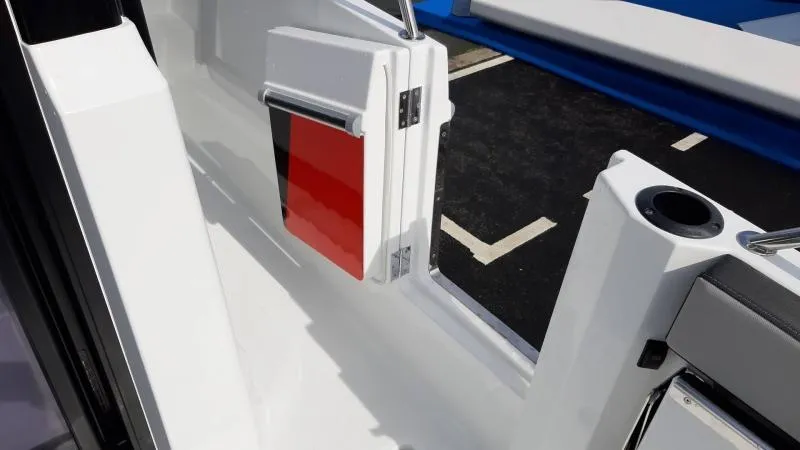 Slide: The Image of 2025 Jeanneau 795 SPORT S2 boat interior with sleek white design and red accents. - 13