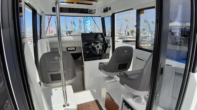 Slide: The Image of Interior of 2025 Jeanneau 795 SPORT S2 boat with modern helm and seating. - 20