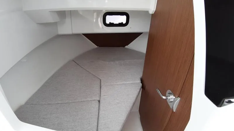 Slide: The Image of Interior cabin of 2025 Jeanneau 795 SPORT S2 boat, featuring cozy sleeping area. - 25