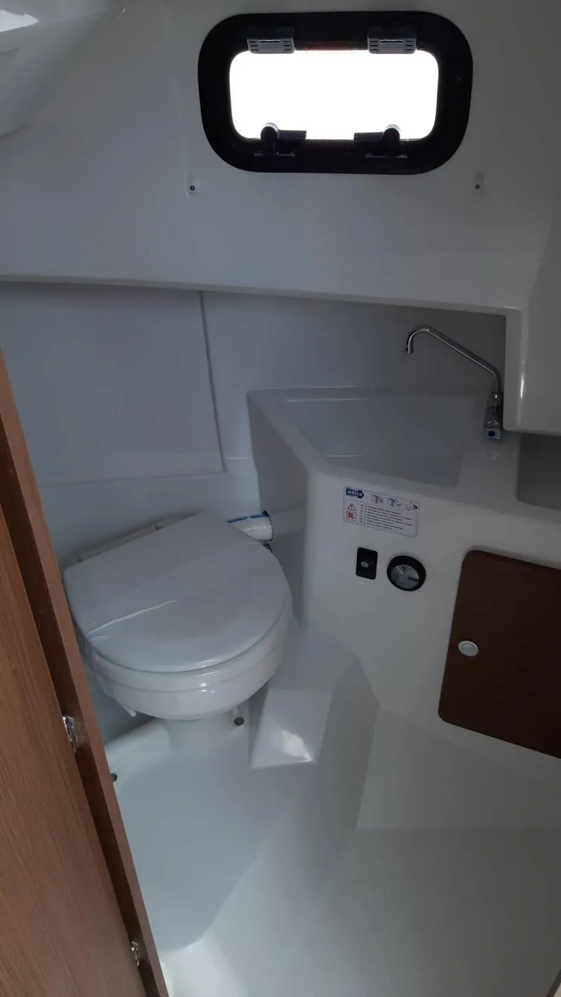 Slide: The Image of 2025 Jeanneau 795 SPORT S2 boat interior bathroom with toilet and sink. - 26