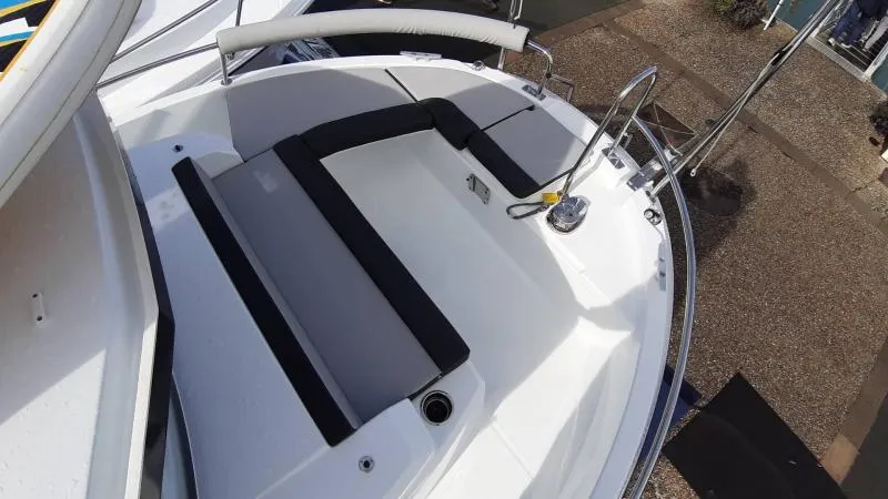 Slide: The Image of 2025 Jeanneau 795 SPORT S2 boat deck with seating and railing. - 4