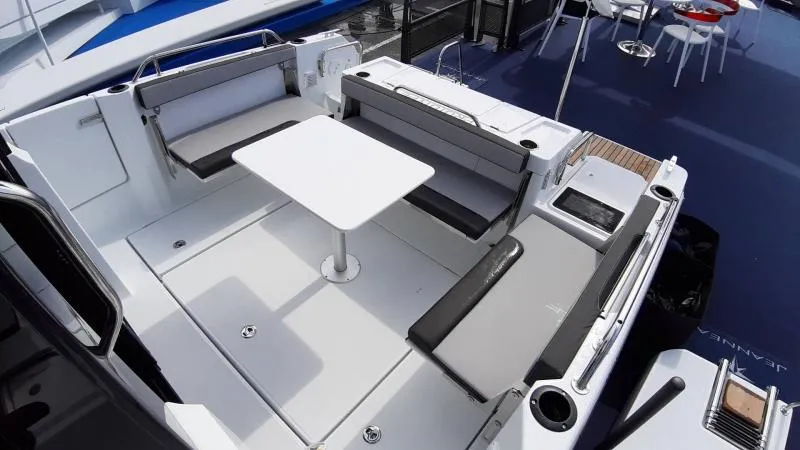 Slide: The Image of 2025 Jeanneau 795 SPORT S2 boat interior with seating and table. - 7