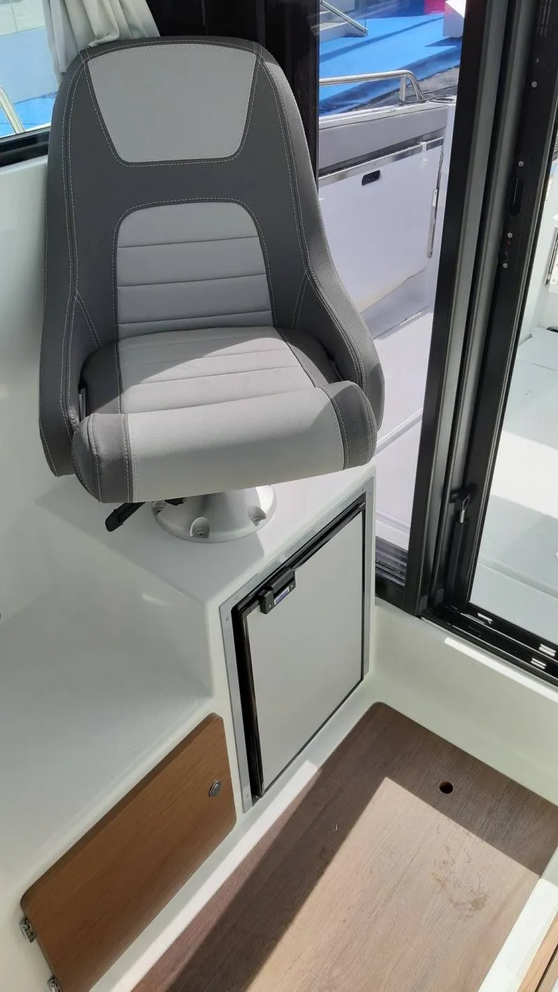 Slide: The Image of 2025 Jeanneau 795 SPORT S2 interior with modern seating and storage. - 15