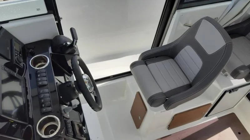 Slide: The Image of Interior of 2025 Jeanneau 795 SPORT S2 boat, featuring modern helm and seating. - 22