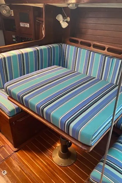 Slide: The Image of Interior of 1989 Ericson 35 MKIII sailboat with striped blue cushions. - 18