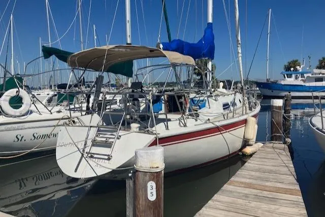 Slide: The Image of 1989 Ericson 35 MKIII sailboat docked at marina under clear blue sky. - 4