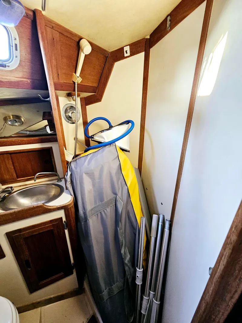Slide: The Image of Interior of 1989 Ericson 35 MKIII sailboat with compact sink and storage area. - 45