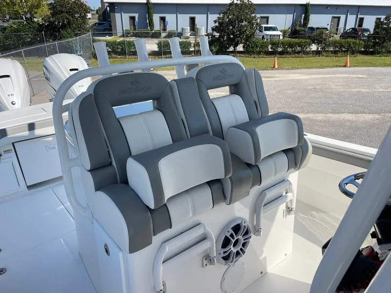 Slide: The Image of 2022 Regulator 31 boat with dual cushioned seats and speaker system. - 8