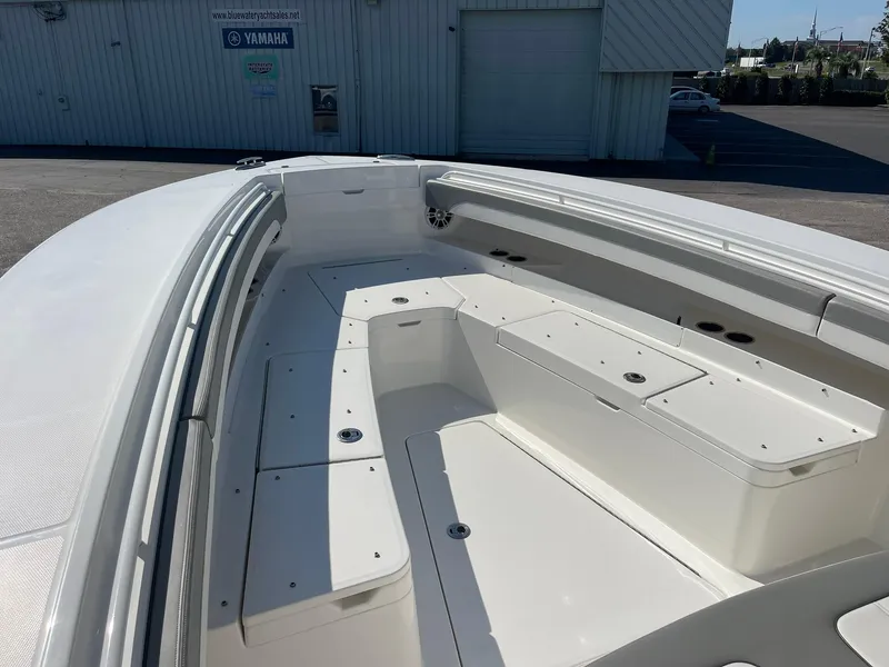 Slide: The Image of 2022 Regulator 31 boat interior with spacious seating and storage. - 9