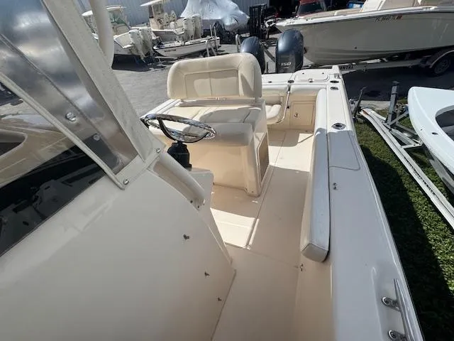 Slide: The Image of 2015 Grady-White Fisherman 257 boat interior with steering wheel and seating. - 16