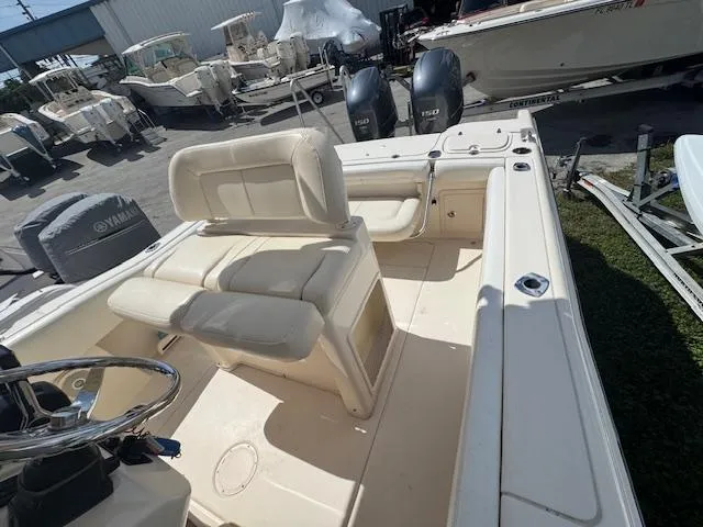 Slide: The Image of 2015 Grady-White Fisherman 257 boat interior with seating and dual engines. - 17